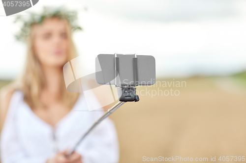 Image of close up of woman taking selfie by smartphone