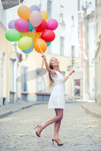 Image of woman with colorful balloons