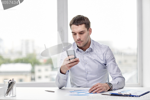 Image of close up of businessman with smartphone
