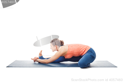 Image of Woman doing Ashtanga Vinyasa Yoga asana Janu sirsasana