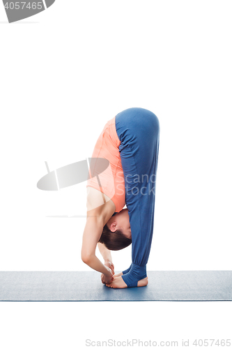 Image of Woman doing Ashtanga Vinyasa Yoga asana Padangushthasana