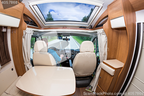 Image of Man driving on a road in the Camper Van