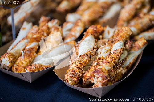 Image of close up of pastry in serving paper boxes