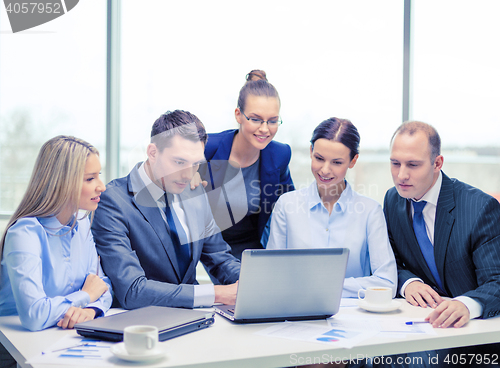 Image of business team with laptop having discussion