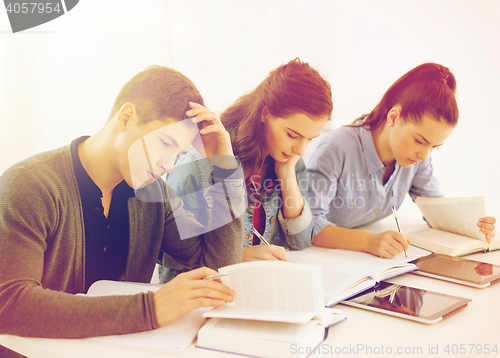 Image of students with notebooks and tablet pc at school