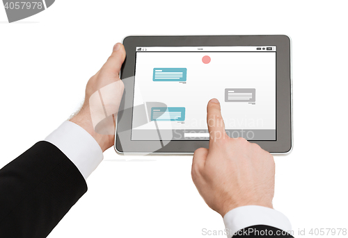 Image of close up of hands holding tablet pc with messenger