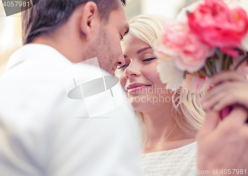 Image of couple with flowers in the city