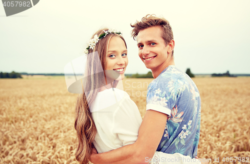 Image of happy smiling young hippie couple outdoors