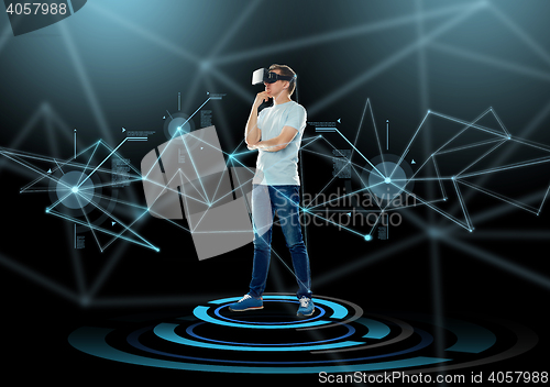 Image of happy man in virtual reality headset or 3d glasses