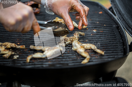 Image of close up of frog meat grill at street market