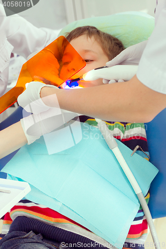 Image of Boy and dentist during a dental procedure