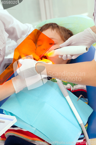 Image of Boy and dentist during a dental procedure