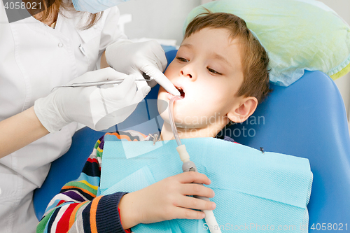 Image of Boy and dentist during a dental procedure