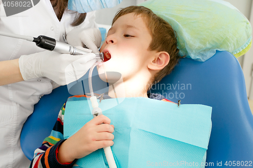 Image of Boy and dentist during a dental procedure