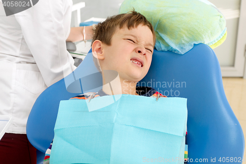 Image of Boy and dentist during a dental procedure