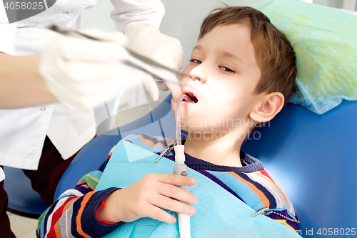 Image of Boy and dentist during a dental procedure