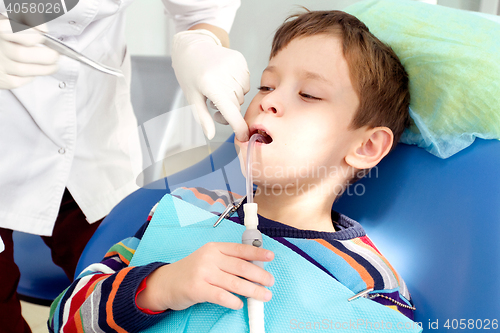 Image of Boy and dentist during a dental procedure