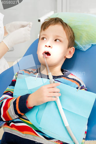 Image of Boy and dentist during a dental procedure