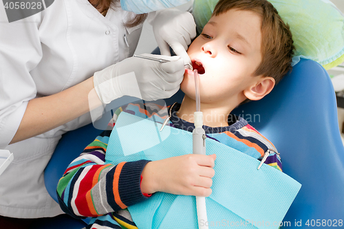 Image of Boy and dentist during a dental procedure