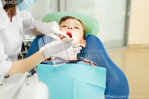 Image of Boy and dentist during a dental procedure