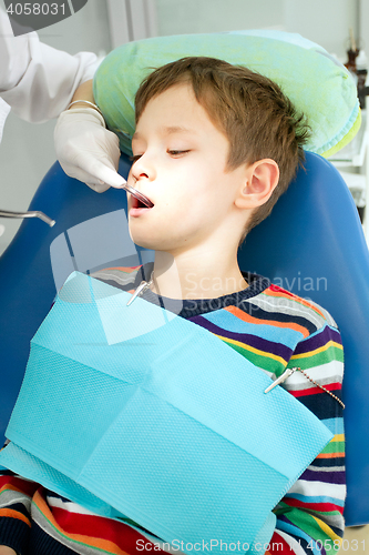 Image of Boy and dentist during a dental procedure