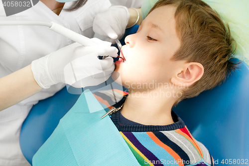 Image of Boy and dentist during a dental procedure