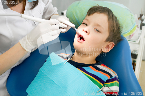 Image of Boy and dentist during a dental procedure