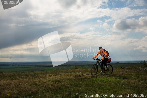 Image of Young man is riding bicycle outside. Healthy Lifestyle.