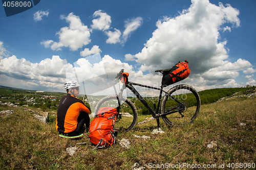 Image of View of a Young Man With Bicycle on Summer Background.