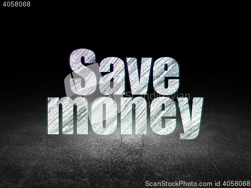 Image of Currency concept: Save Money in grunge dark room