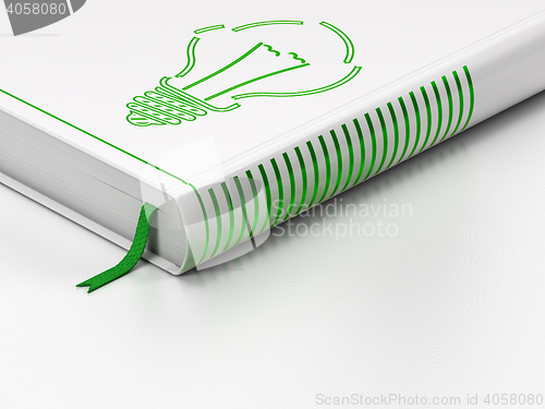 Image of Finance concept: closed book, Light Bulb on white background