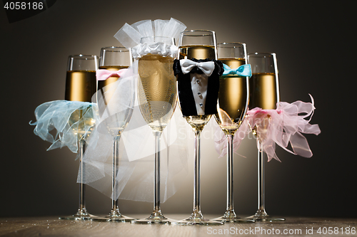 Image of Composition of stylized glasses with champagne for wedding party