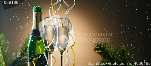 Image of Champagne glasses decorated ribbons. Merry Christmas and happy new year