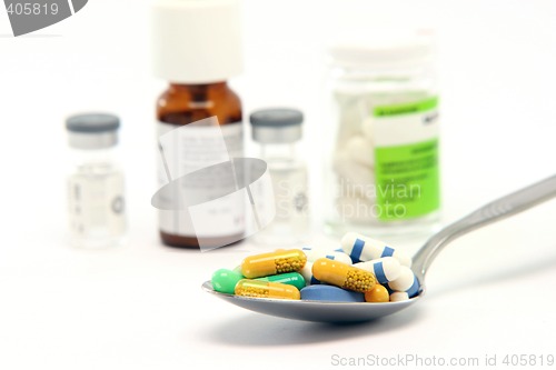 Image of spoon pills and bottles