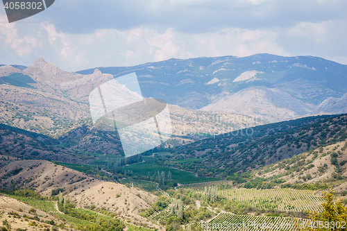 Image of Panoramic views of valley, forests, hills and mountains