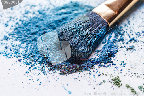 Image of Shadows of blue-green color with brush on white background