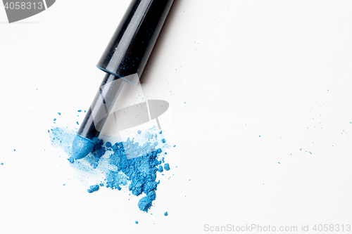 Image of Scattered blue shadows with applicator on pure background