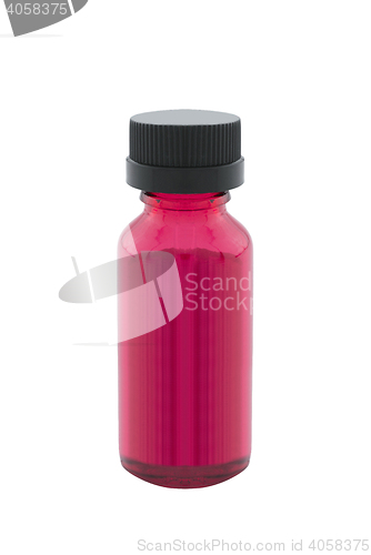 Image of Bottle of red liquid isolated