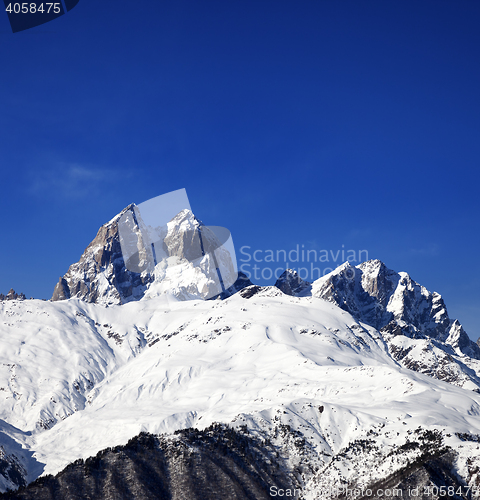 Image of Snow mountains in winter at sun day