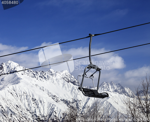 Image of Ski lift in snow winter mountains at nice sunny day