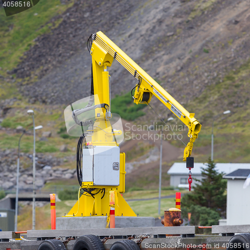 Image of Fishing crane in small seaside Iceland town harbor