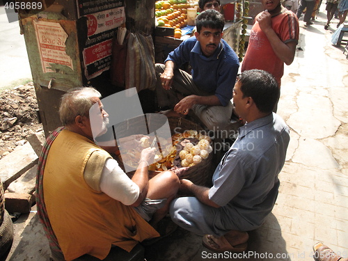 Image of Mobile stall selling fruit juice on the street in Kolkata, India