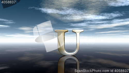 Image of metal uppercase letter u under cloudy sky - 3d rendering