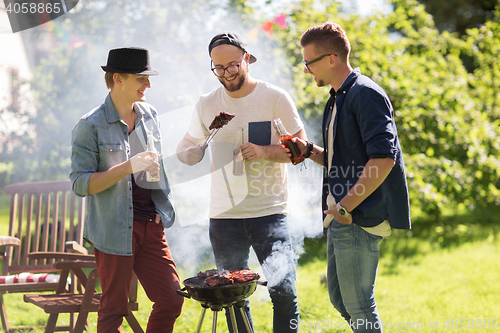 Image of friends drinking beer at summer barbecue party