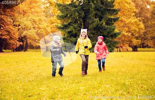 Image of group of happy little kids running outdoors