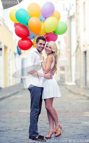 Image of couple with colorful balloons