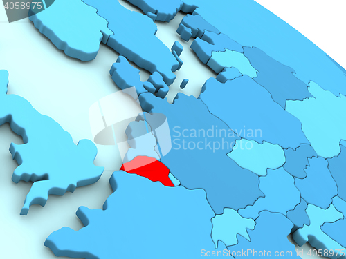 Image of Belgium in red on blue globe