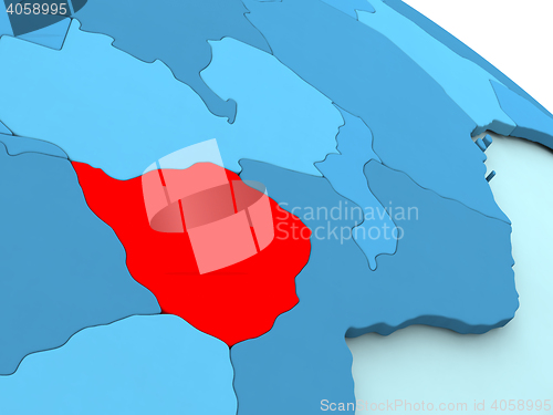 Image of Zimbabwe in red on blue globe
