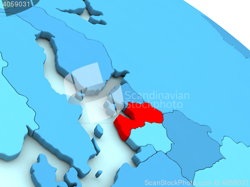 Image of Latvia in red on blue globe