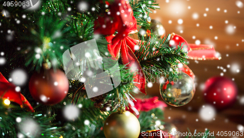 Image of close up of christmas tree decorated with balls